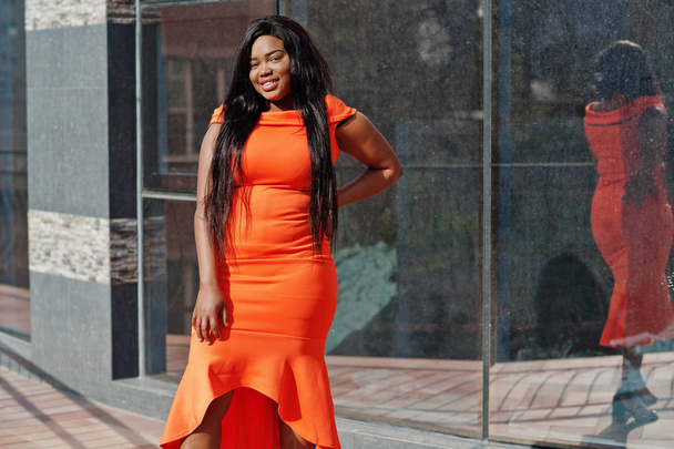 African american woman model xxl in orange dress. - Photo, image