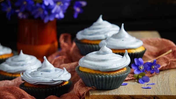 cupcakes with blueberries and easter flowers - Photo, Image