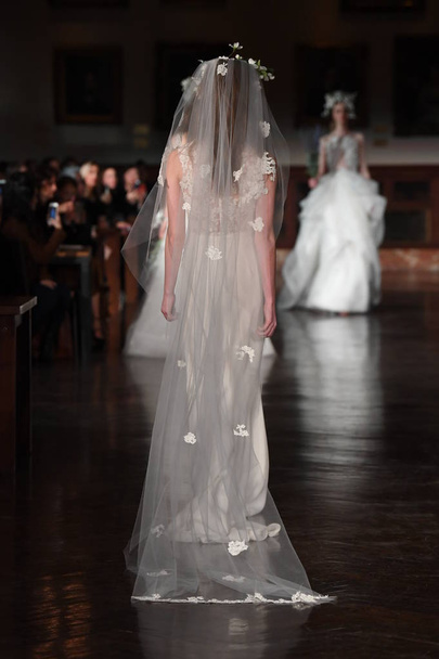 NEW YORK, NY - APRIL 12: A model walks the runway wearing Reem Acra Spring 2019 Bridal Collection at the New York Public Library on April 12, 2018 in New York City.  - Φωτογραφία, εικόνα