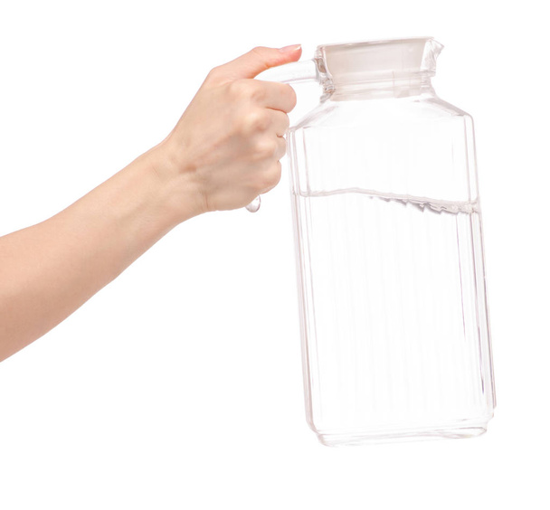Transparent glass carafe with water in hand - Photo, Image