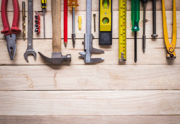 tool kit renovation with top view on  wooden board - Φωτογραφία, εικόνα