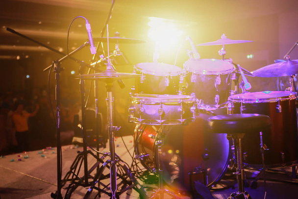 Drum set on stage and the light from the spotlights. - Photo, Image