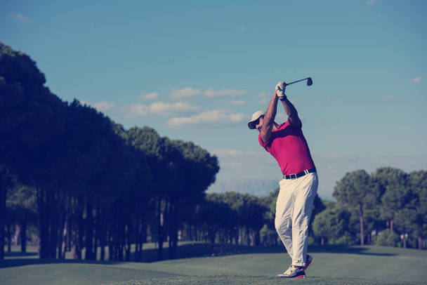 golf player hitting shot on course at beautiful sunny day - Фото, зображення