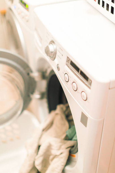 Doing laundry in laundry room - Φωτογραφία, εικόνα