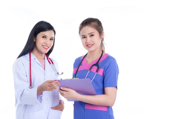 Beautiful Asian doctor and nurse, meadical team smiling at camera - Fotó, kép