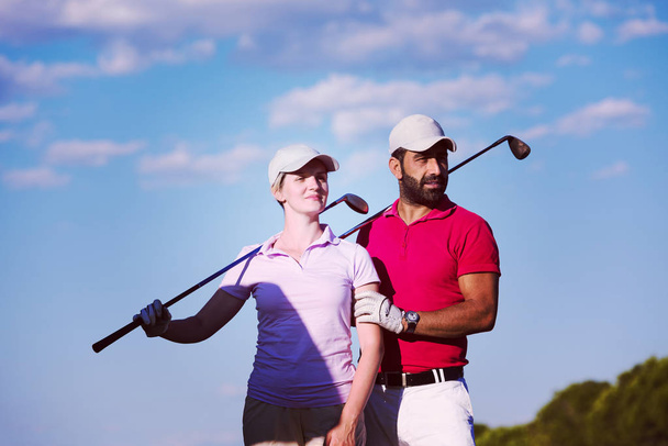 portrait of happy young couple on golf course - Foto, Imagen