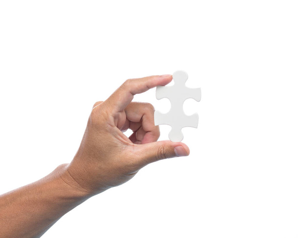 Homme main tenant puzzle puzzle sur fond blanc
 - Photo, image