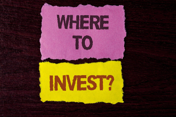 Writing note showing  Where To Invest Question. Business photo showcasing Right Place Stock Share to spend your savings in written on Tear Sticky Note Papers on the wooden background. - Photo, Image