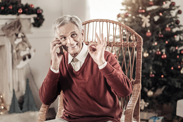 Happy pensioner having Christmas mood - Φωτογραφία, εικόνα