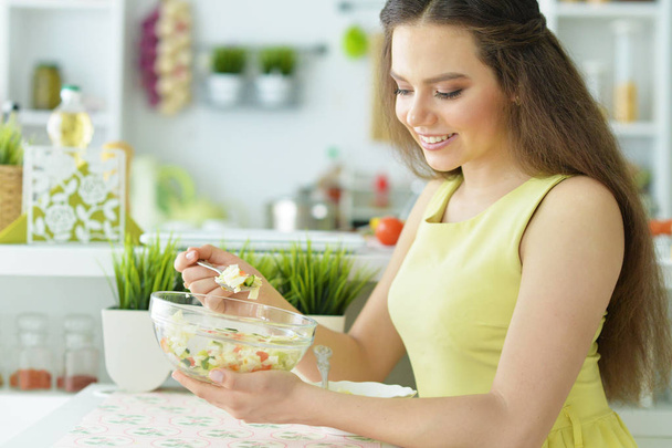young woman eating salad - Photo, Image