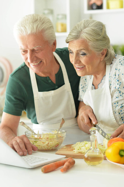 senior couple cooking together  - Фото, зображення