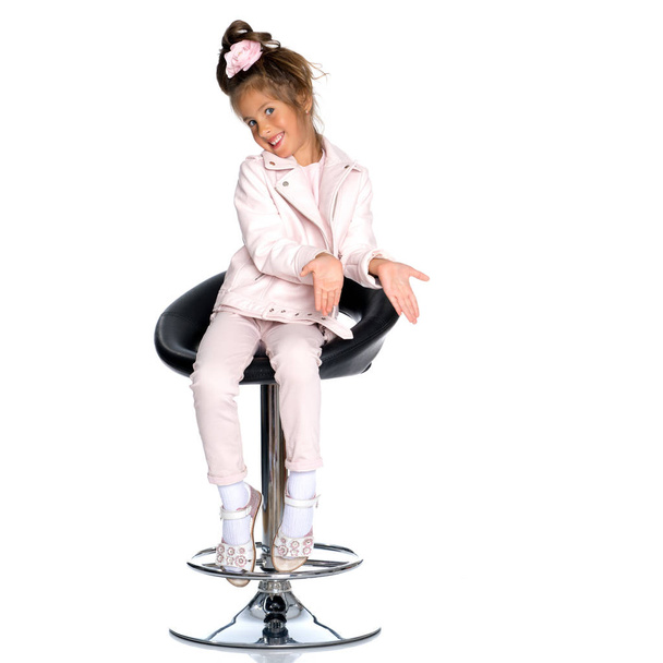 Little girl on a swivel chair - Photo, Image