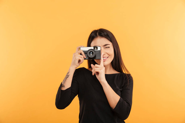 Cheerful young woman photographer - Fotó, kép