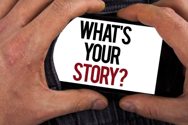 Conceptual hand writing showing What Is Your Story Question. Business photo showcasing Telling personal past experiences Storytelling written on Mobile holding by man on the Jeans background. - Photo, Image