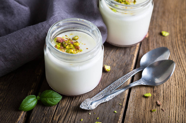 Natural yogurt in a glass jar - Foto, immagini