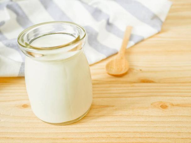 A jar of plain yogurt  - Фото, зображення