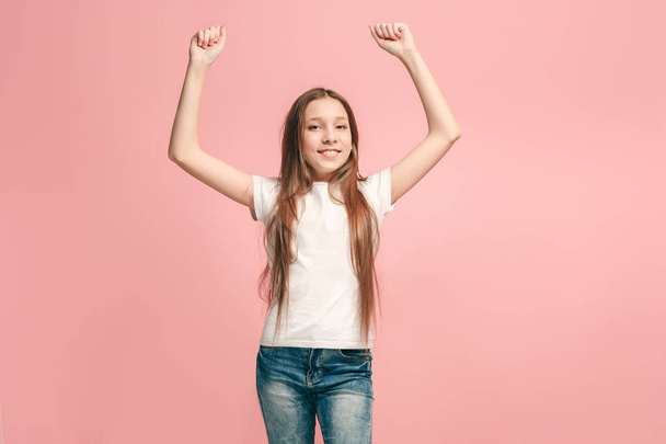 Happy success teen girl celebrating being a winner. Dynamic energetic image of female model - Fotoğraf, Görsel