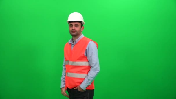 Керівник будівництва або інженер проти зелений екран - Кадри, відео