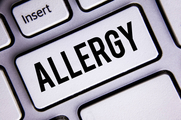 Text sign showing Allergy. Conceptual photo damages in immunity due to hypersensitivity get it diagnised written on White Keyboard Key with copy space. Top view. - Photo, Image