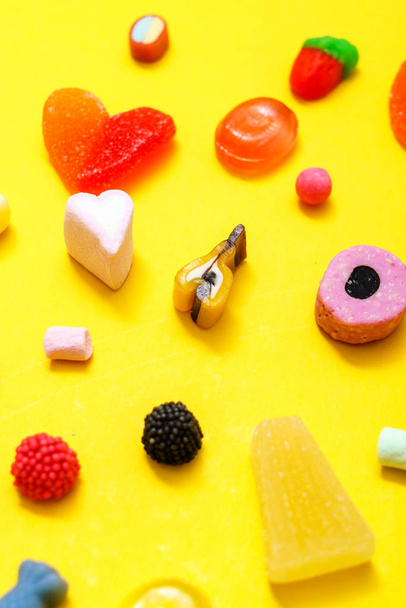 colorful candy on the yellow background - Φωτογραφία, εικόνα