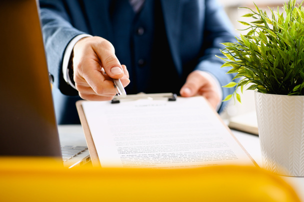 Male arm in suit offer contract form on clipboard - Фото, изображение