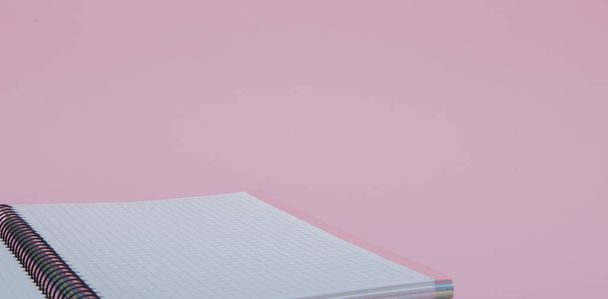 Notebook on pink background - Foto, afbeelding
