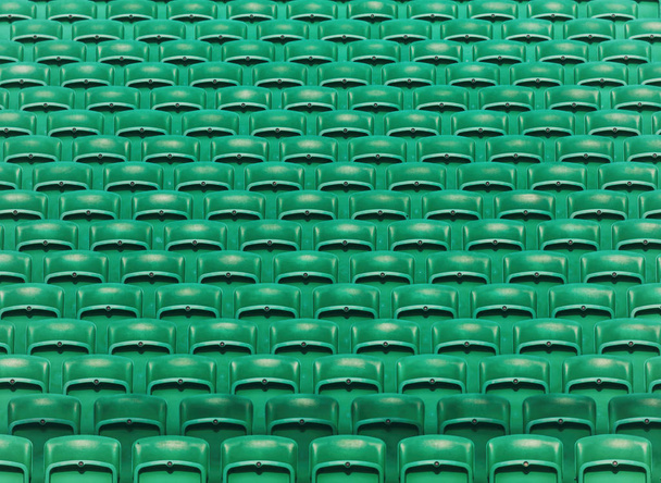 Vihreä tyhjä stadion kokoontaitettava istuimet tausta
 - Valokuva, kuva