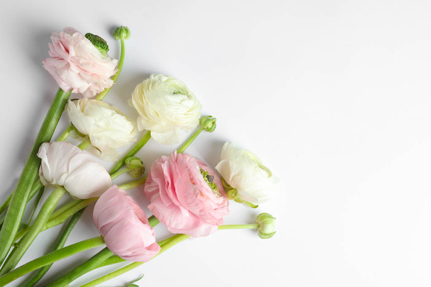 Beautiful ranunculus flowers on white background - Fotó, kép