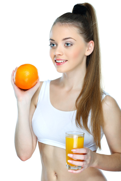 Portrait of a pretty young woman with glass of juice isolated on a white background - Foto, Bild