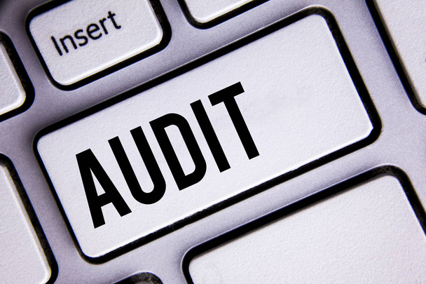 Text sign showing Audit. Conceptual photo Local company auditors perform their financial investigation annually written on White Keyboard Key with copy space. Top view. - Photo, Image