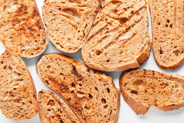 Saboroso pão torrado como fundo
 - Foto, Imagem