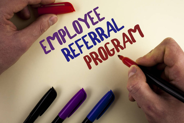 Text sign showing Employee Referral Program. Conceptual photo strategy work encourage employers through prizes written by Man on plain background Markers next to it. - Photo, Image