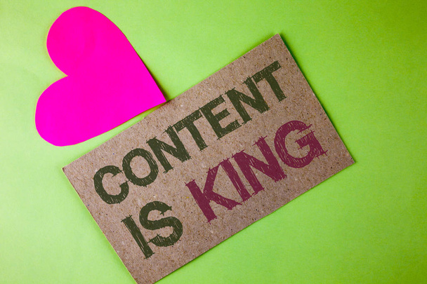 Conceptual hand writing showing Content Is King. Business photo text articles or posts can guarantee you success Advertising written on Cardboard Piece on the plain background Heart next to it - Photo, Image