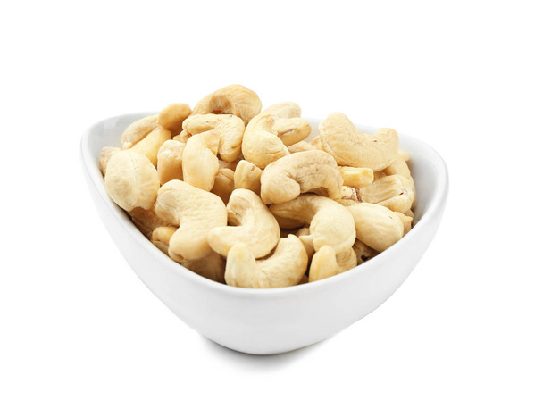 Bowl with tasty cashew nuts on white background - Valokuva, kuva