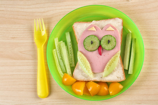 Creative breakfast for children on plate. Recipe ideas with bread - Фото, зображення