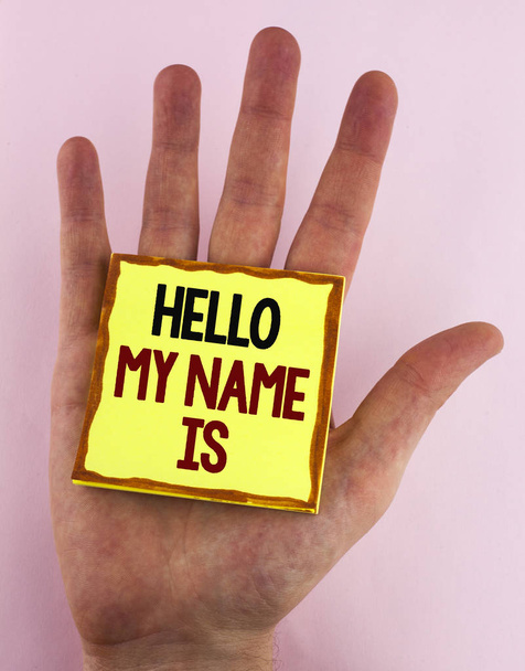 Word writing text Hello My Name Is. Business concept for meeting someone new Introduction Interview Presentation written on Sticky Note Paper placed on the Hand on the plain background. - Photo, Image