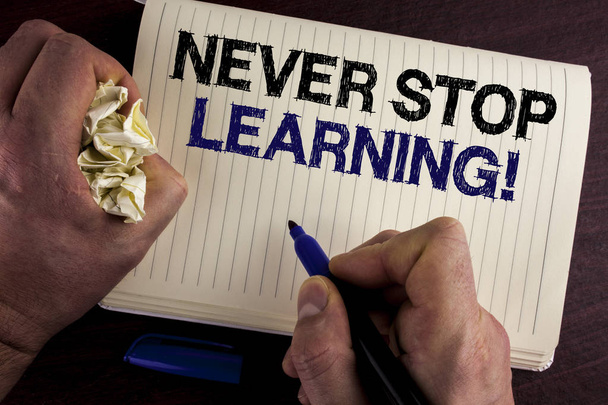 Writing note showing  Never Stop Learning Motivational Call. Business photo showcasing Keep educating yourself Improve Skills written by Man on Notebook Book on wooden background Pen Crumpled Paper - Photo, Image