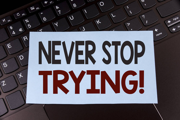 Text sign showing Never Stop Trying Motivational Call. Conceptual photo go on do not give up Self confidence written on Sticky Note Paper placed on the Laptop. - Photo, Image