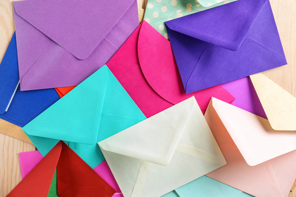Colorful envelopes on table, top view. Mail service - Photo, Image