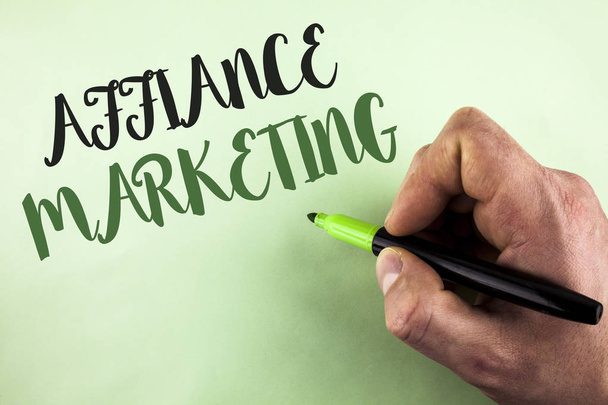 Text sign showing Affiance Marketing. Conceptual photo joining two or more companies in same field mutual goal written by Man holding Marker in Hand on plain background. - Фото, изображение