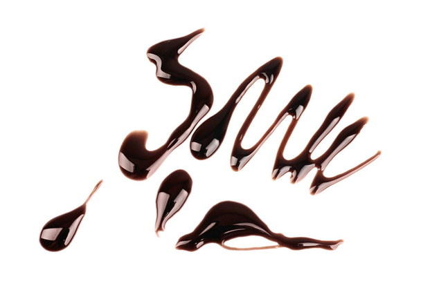 Візерунок з шоколадного сиропу на білому тлі
 - Фото, зображення