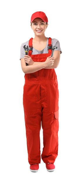 Female car mechanic with tools on white background - Foto, immagini