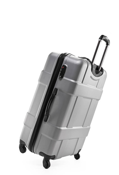 grey suitcase plastic on two wheels - Foto, afbeelding