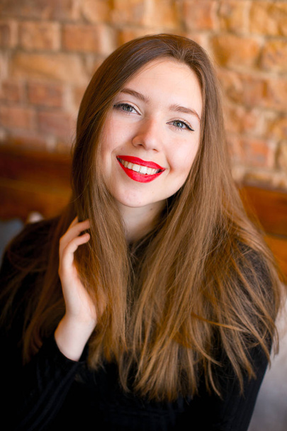 Smiling beautiful girl with scarlet lips. - Valokuva, kuva