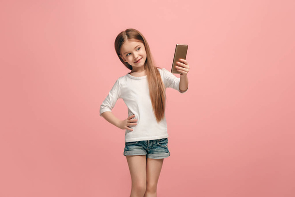 The happy teen girl making selfie photo by mobile phone - Fotoğraf, Görsel