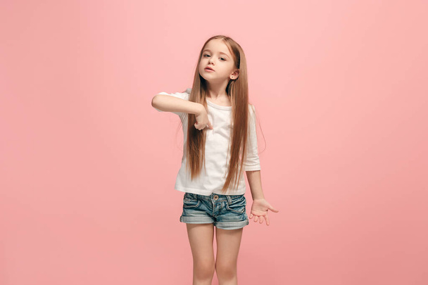 Beautiful female half-length portrait on pink studio backgroud. The young emotional teen girl - Foto, Imagem