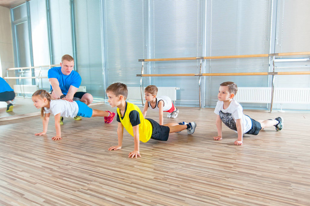 Children at physical education lesson in school gym gymnast kid - Фото, зображення
