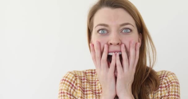 Shocked happy woman covering mouth isolated - Video