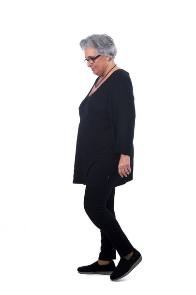 portrait of a senir woman walking on white - Fotografie, Obrázek