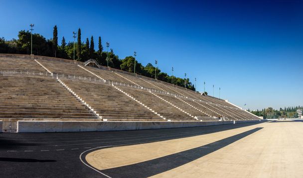 Bleachers and race track at Panathinaiko Stadium under sunlight, Athens, Greece, Europe - Fotografie, Obrázek